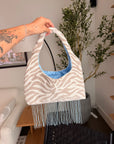 Beige tiger print shoulder bag with beaded fringe