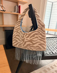 Beige tiger print shoulder bag with beaded fringe